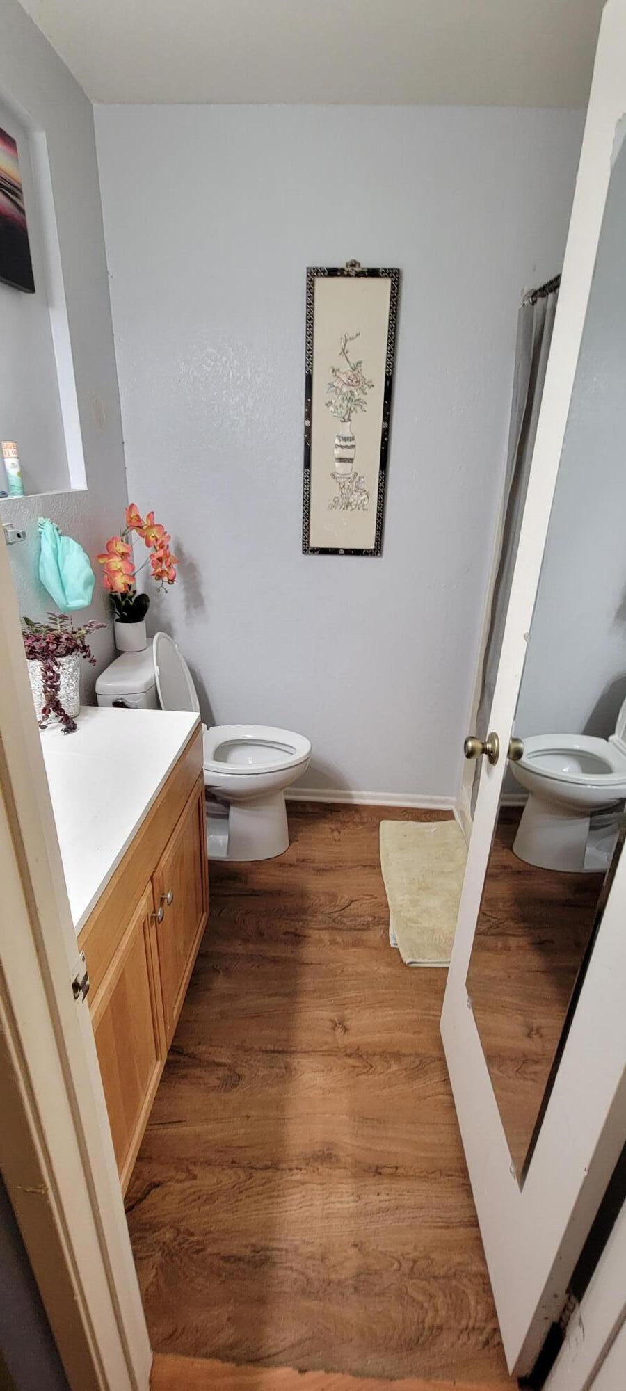 4956 5th Street Carpinteria, CA 93013 - Photo 16 of 16 a bathroom with a sink and a white stove
