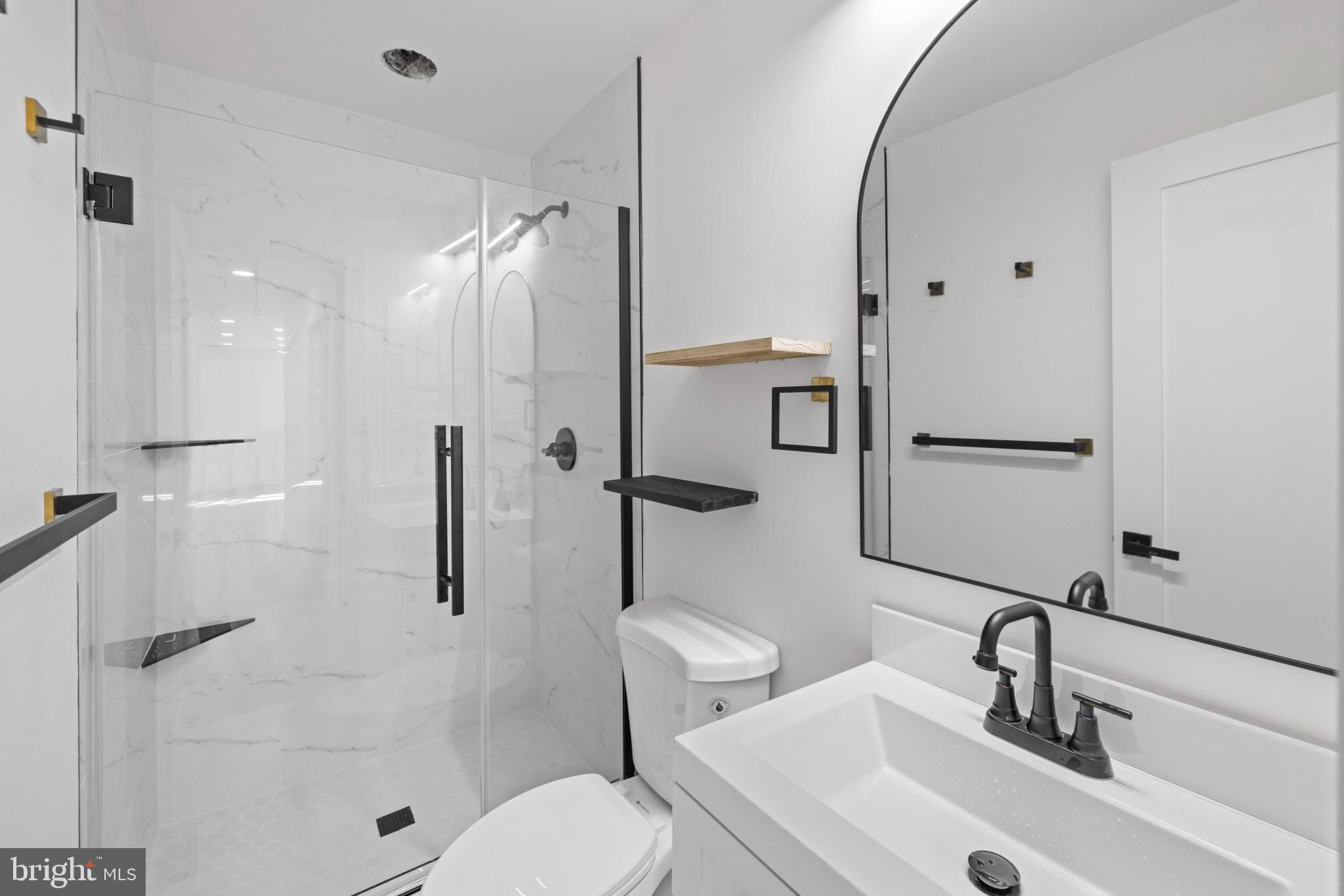 4821 Topping Road Rockville, MD 20852 - Photo 15 of 45 a bathroom with a sink toilet and shower