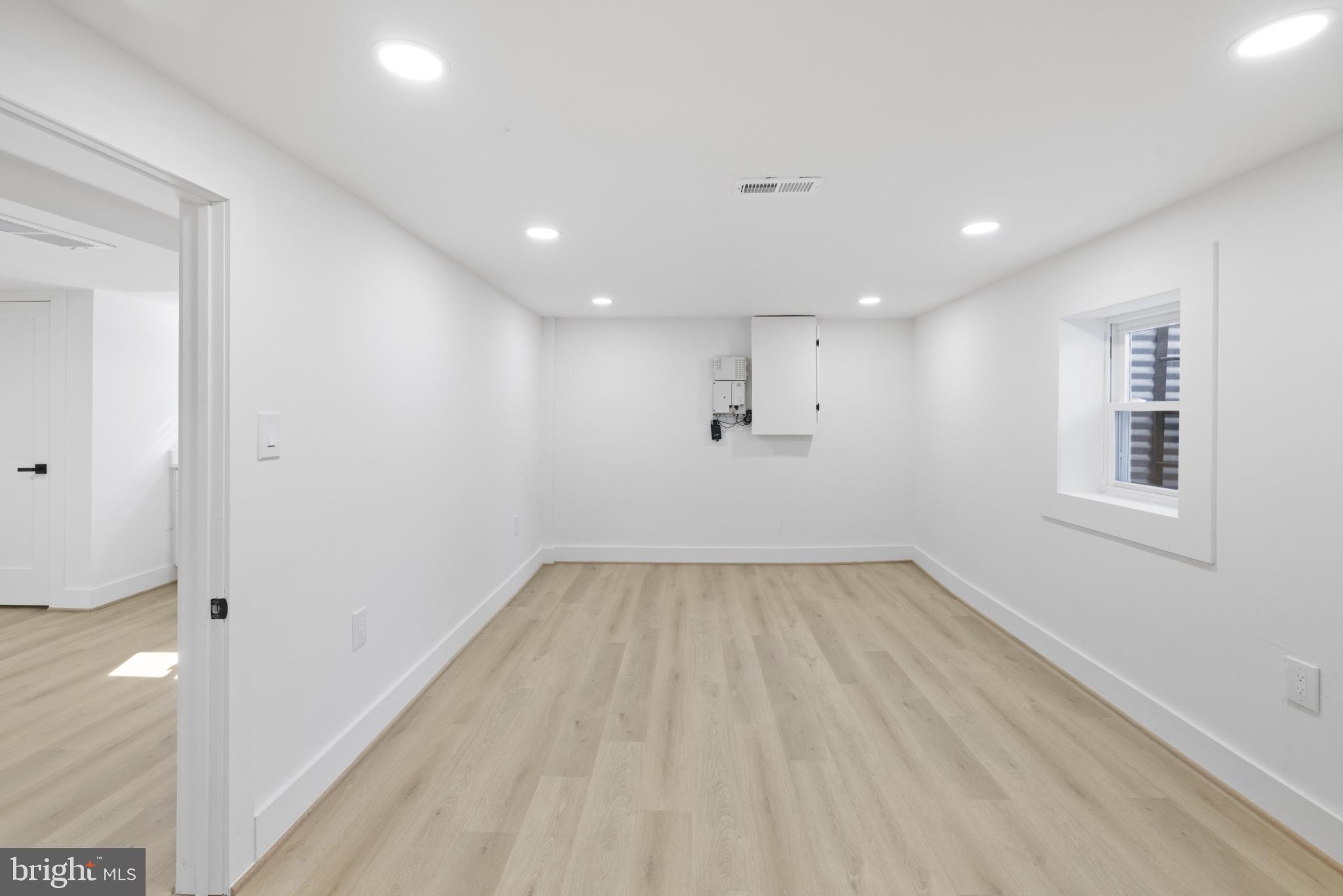 4821 Topping Road Rockville, MD 20852 - Photo 23 of 45 a view of an empty room with wooden floor and a window