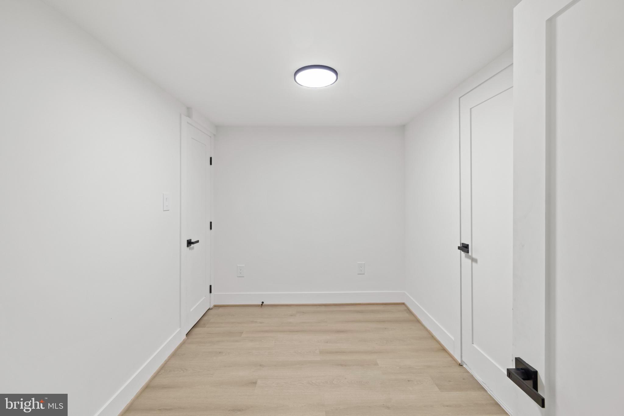 4821 Topping Road Rockville, MD 20852 - Photo 25 of 45 a view of a room with wooden floor and white walls