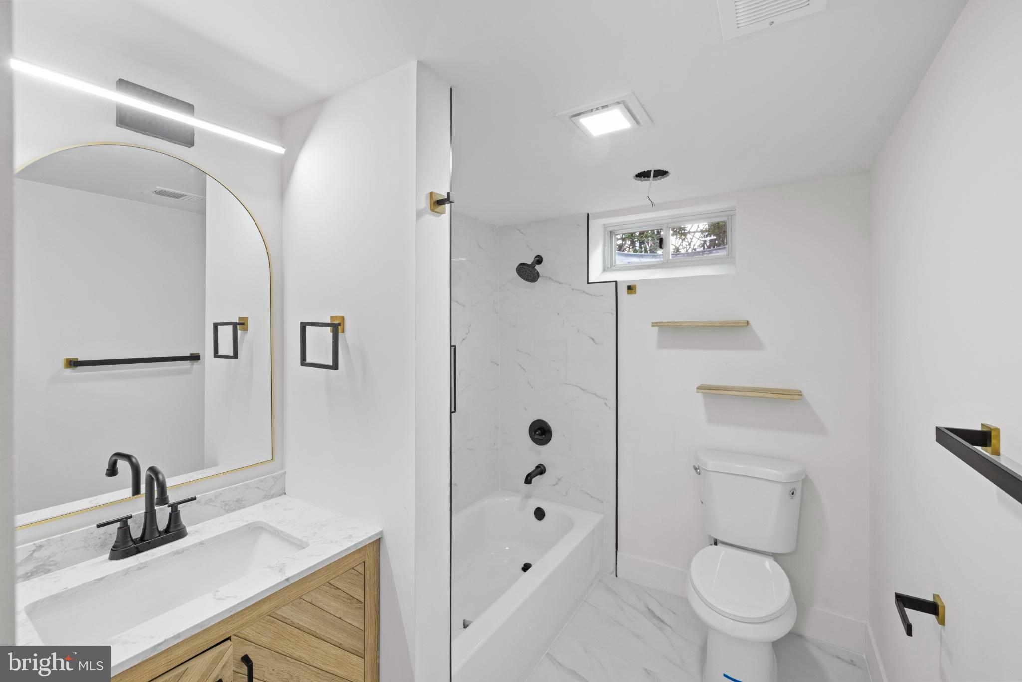 4821 Topping Road Rockville, MD 20852 - Photo 26 of 45 a bathroom with a sink a toilet and shower