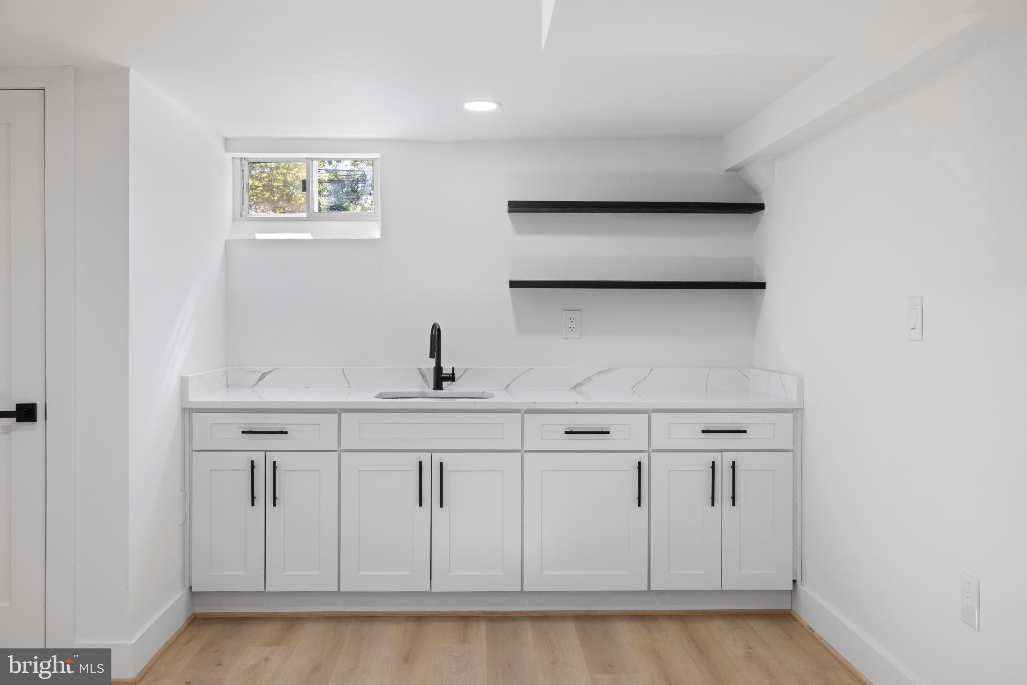 4821 Topping Road Rockville, MD 20852 - Photo 30 of 45 a view of a kitchen with white cabinets