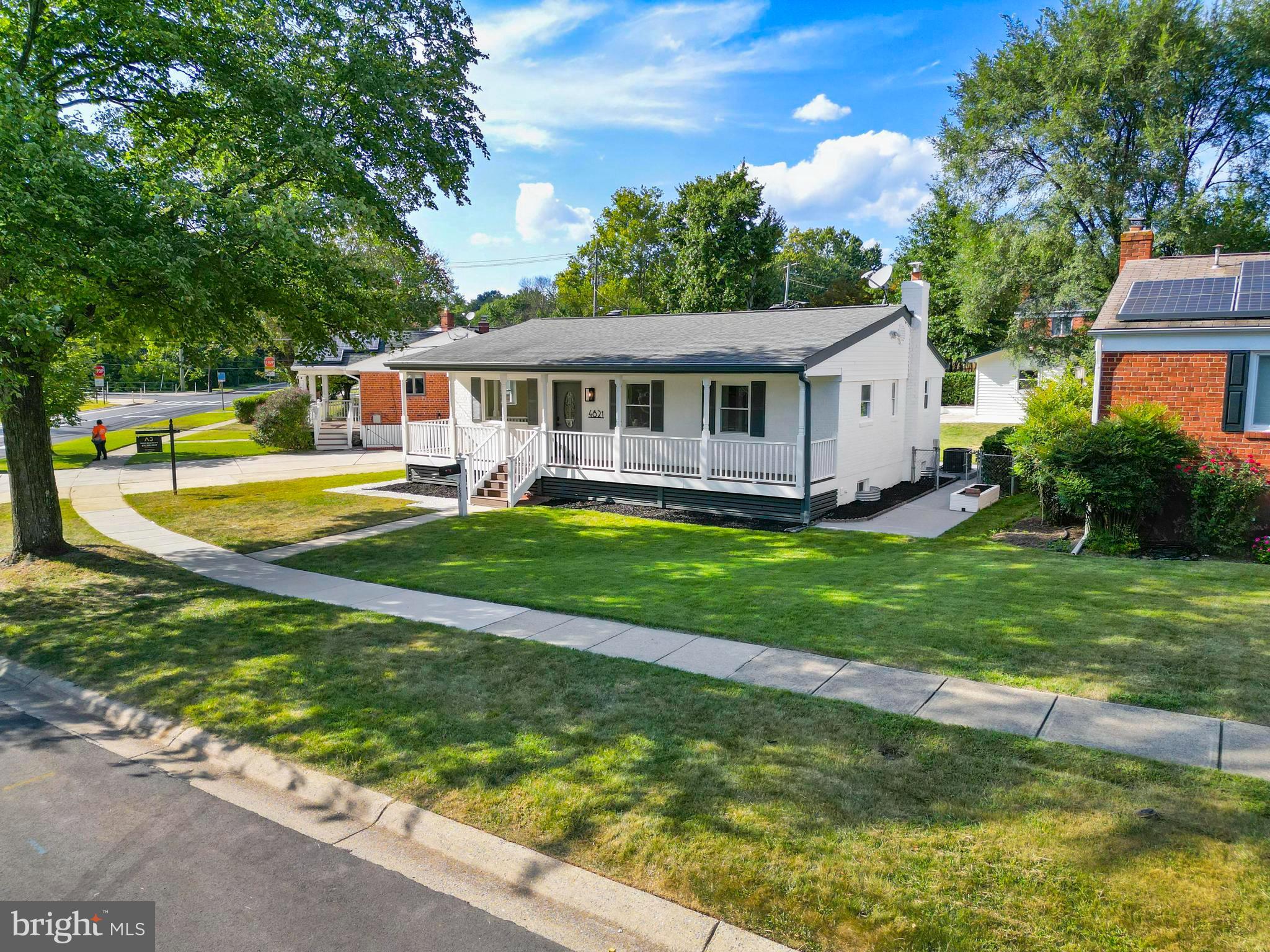 4821 Topping Road Rockville, MD 20852 - Photo 42 of 45 a view of a house with a big yard potted plants and large tree