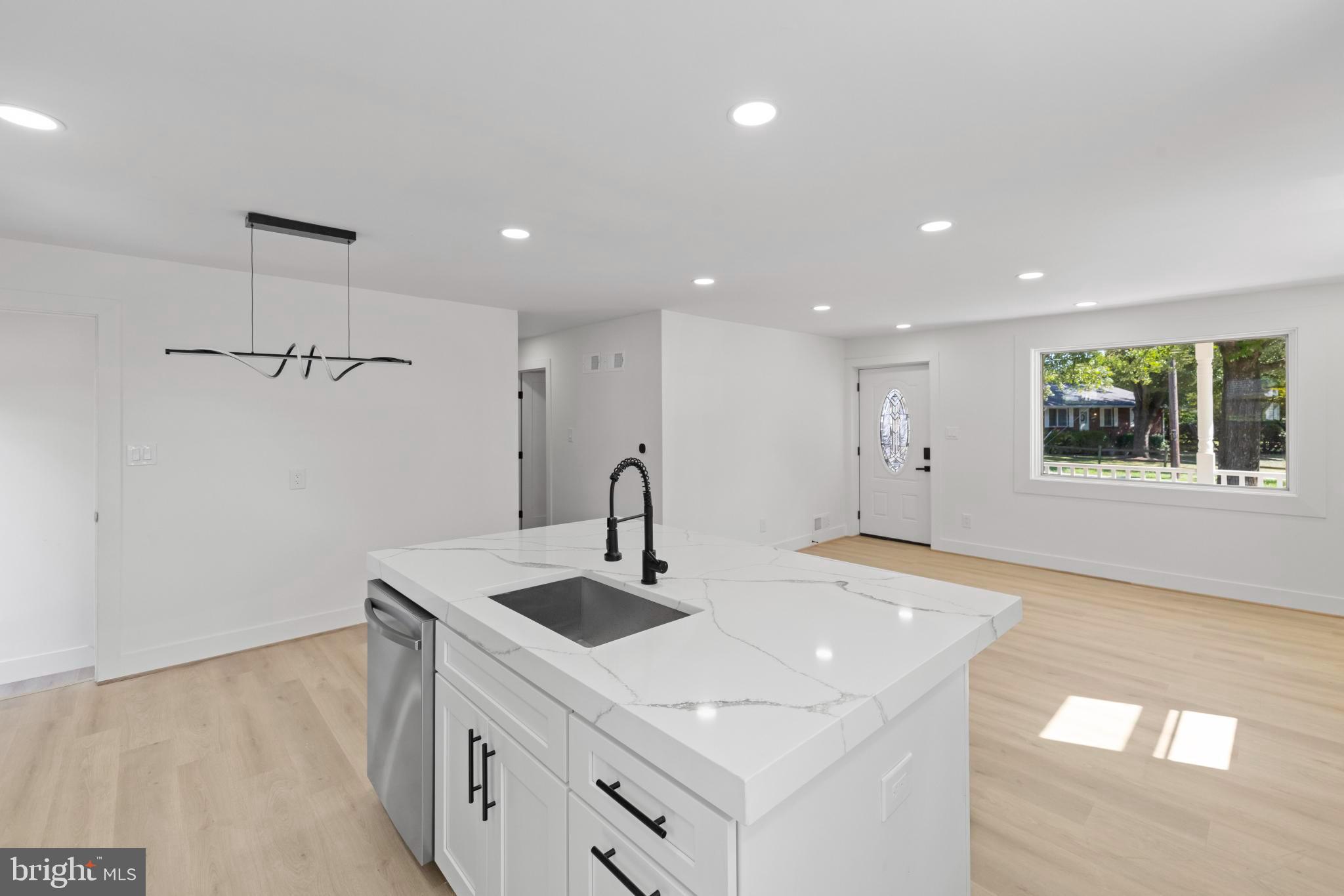 4821 Topping Road Rockville, MD 20852 - Photo 10 of 45 a kitchen with a sink a window and stainless steel appliances