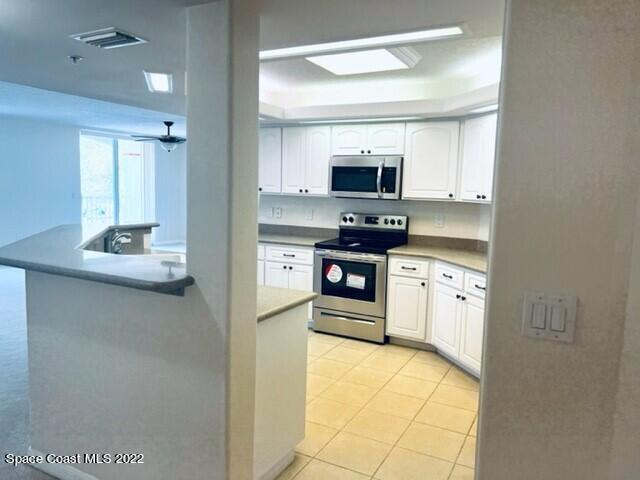 820 Del Rio Way, Unit 204 Merritt Island, FL 32953 - Photo 16 of 72 a kitchen with stainless steel appliances a stove top oven and a refrigerator