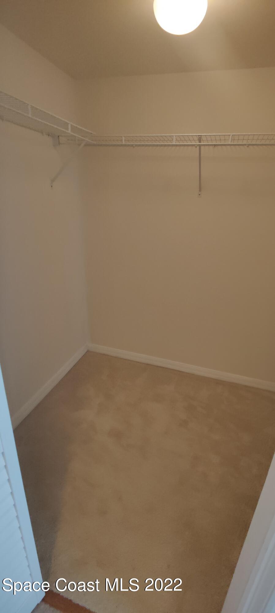 820 Del Rio Way, Unit 204 Merritt Island, FL 32953 - Photo 28 of 72 a view of a room with racks on the wall