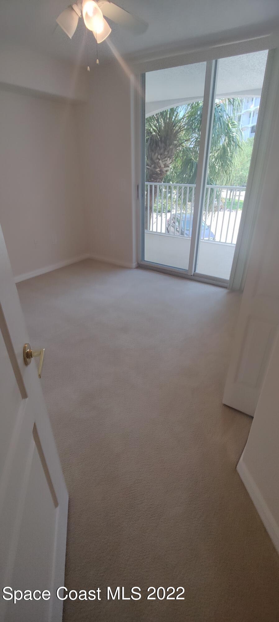 820 Del Rio Way, Unit 204 Merritt Island, FL 32953 - Photo 40 of 72 a view of an empty room with a window