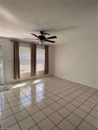 a view of an empty room and wooden floor