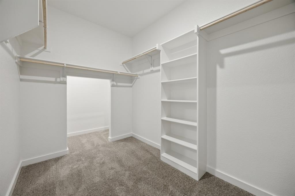 720 Poppy Lane Lavon, TX 75166 - Photo 23 of 36 Primary Closet in the Haylee home plan by Trophy Signature Homes - REPRESENTATIVE PHOTO