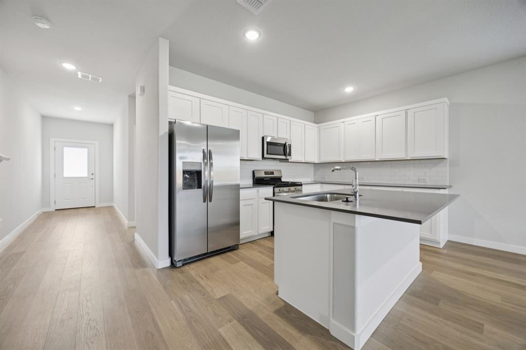 720 Poppy Lane Lavon, TX 75166 - Photo 8 of 36 Kitchen in the Haylee home plan by Trophy Signature Homes - REPRESENTATIVE PHOTO