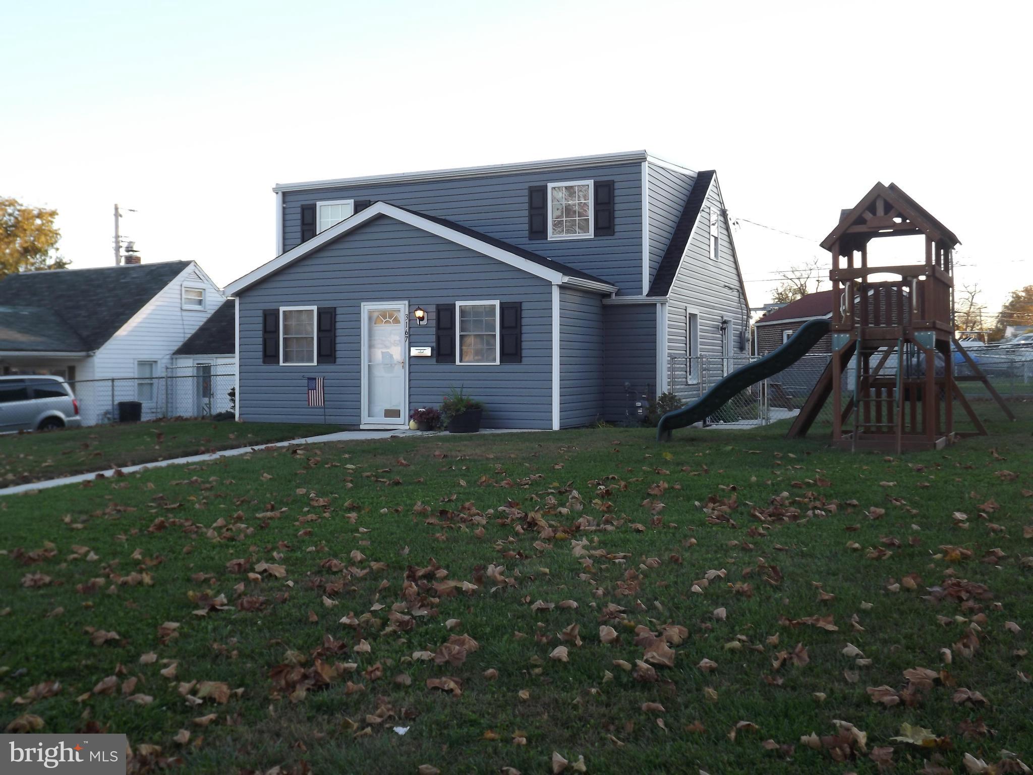 3167 Baybriar Road Baltimore, MD 21222 - Photo 1 of 30 a front view of house with yard and green space
