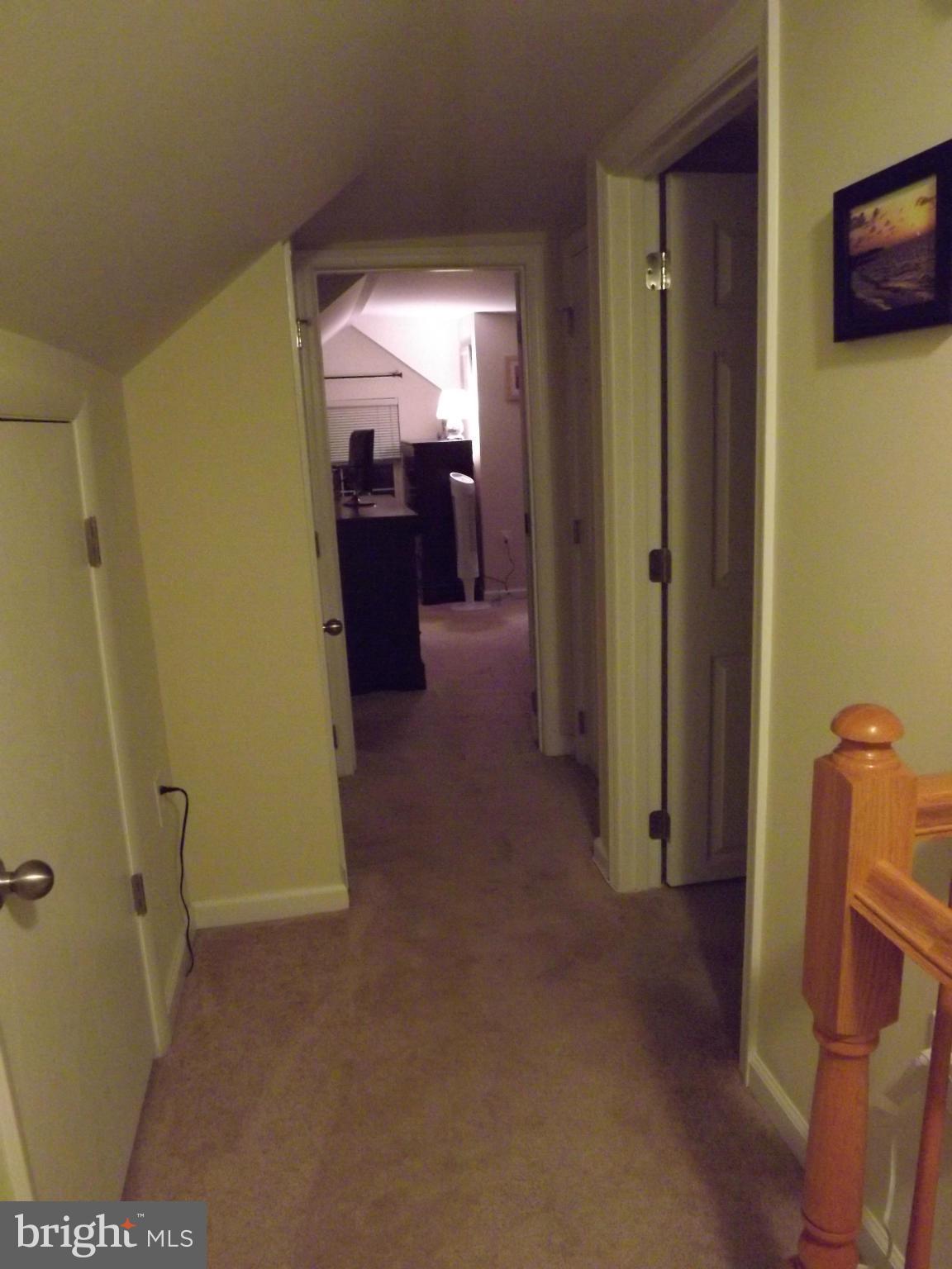 3167 Baybriar Road Baltimore, MD 21222 - Photo 14 of 30 a view of a hallway with wooden shelves