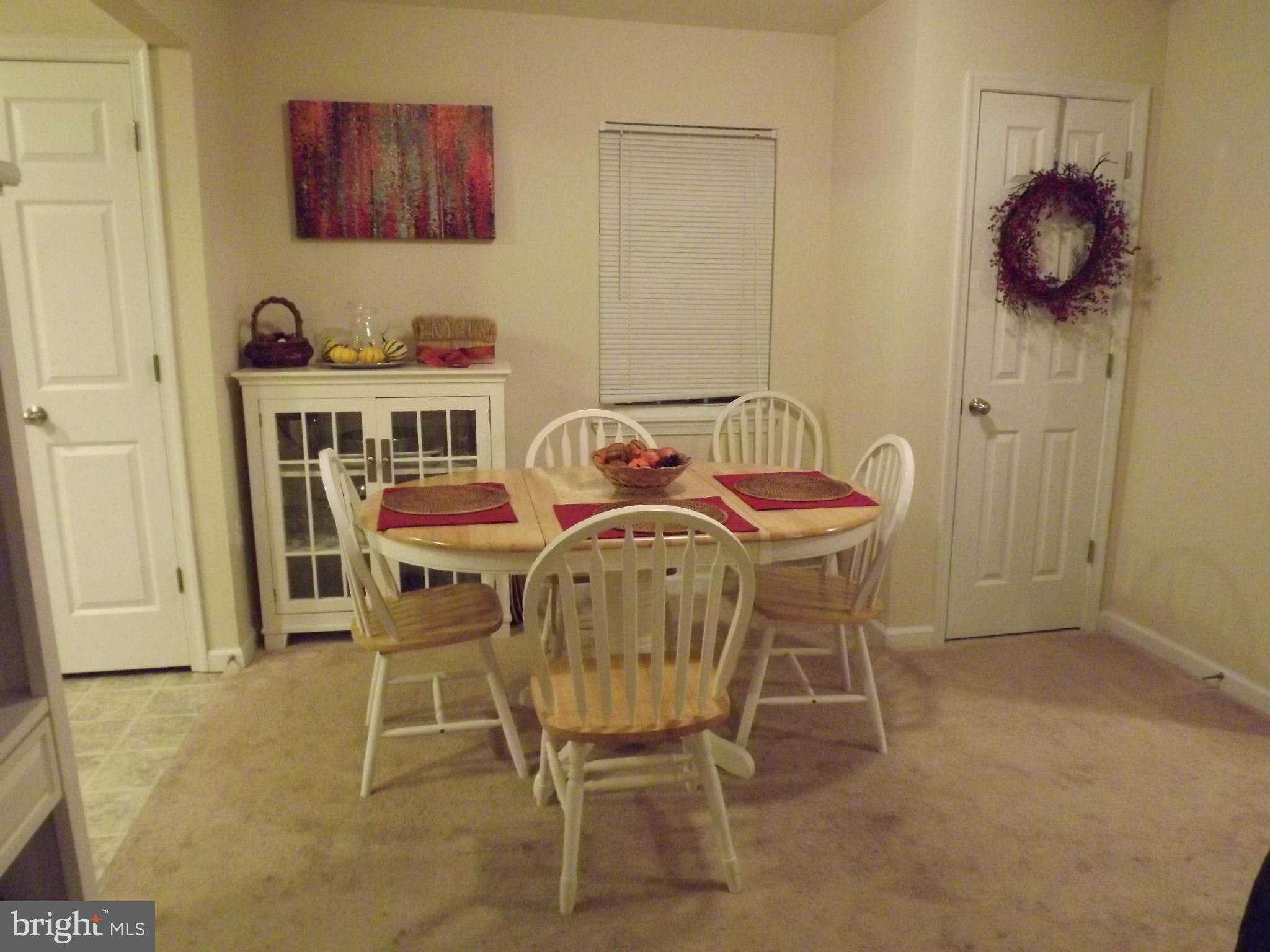 3167 Baybriar Road Baltimore, MD 21222 - Photo 20 of 30 a dining room with furniture and window