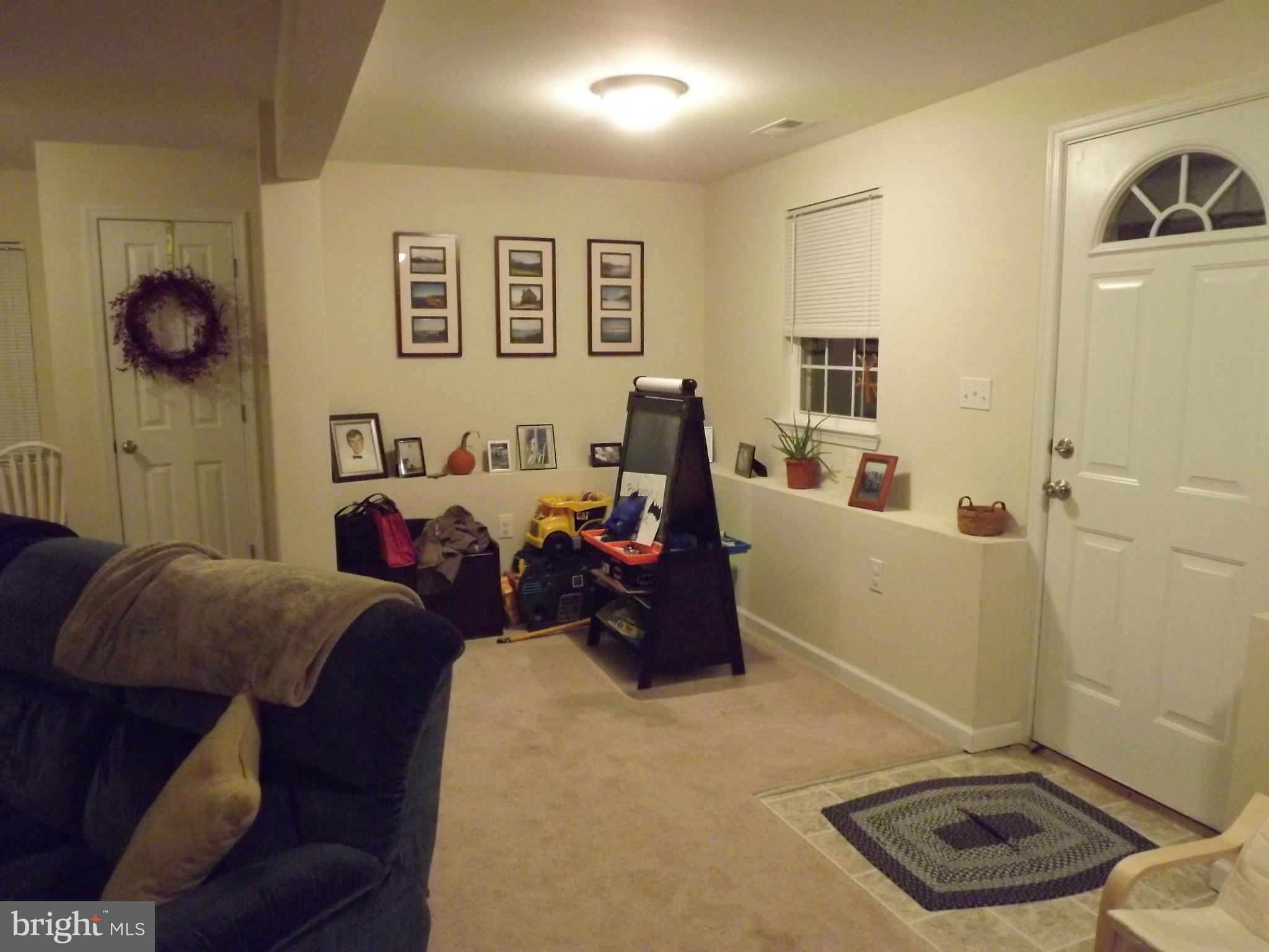 3167 Baybriar Road Baltimore, MD 21222 - Photo 3 of 30 a living room with furniture and a window