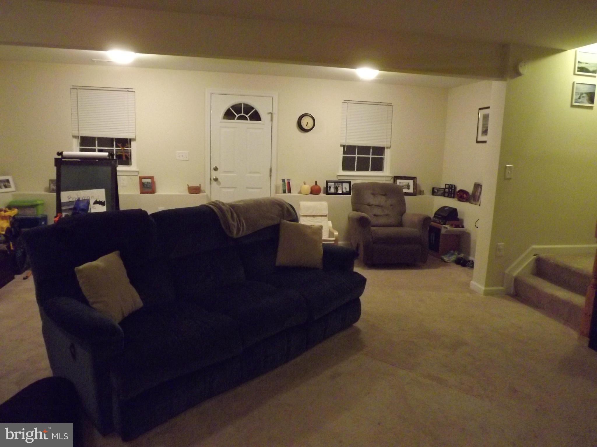 3167 Baybriar Road Baltimore, MD 21222 - Photo 21 of 30 a living room with furniture and a flat screen tv
