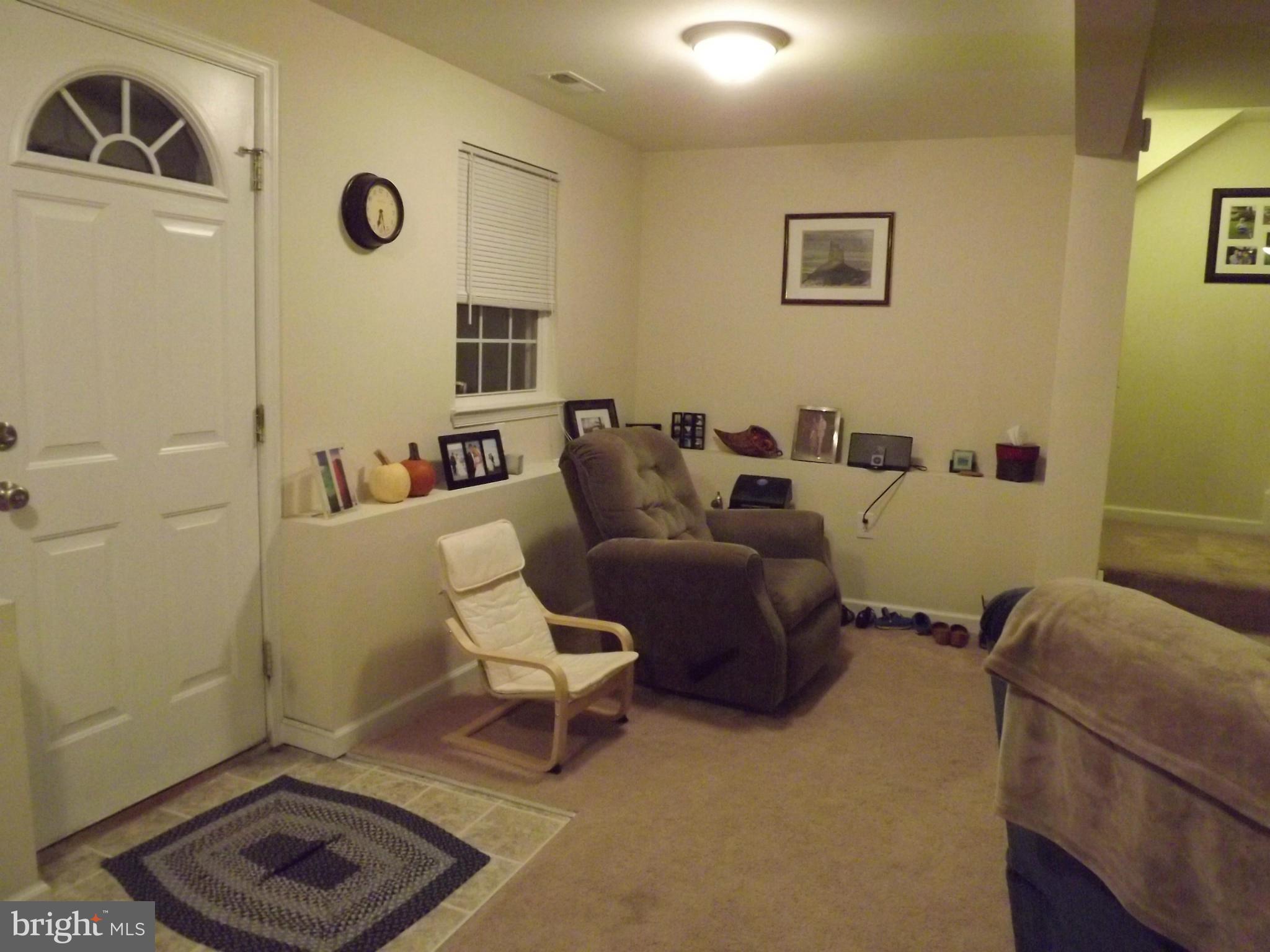 3167 Baybriar Road Baltimore, MD 21222 - Photo 22 of 30 a living room with furniture and a window