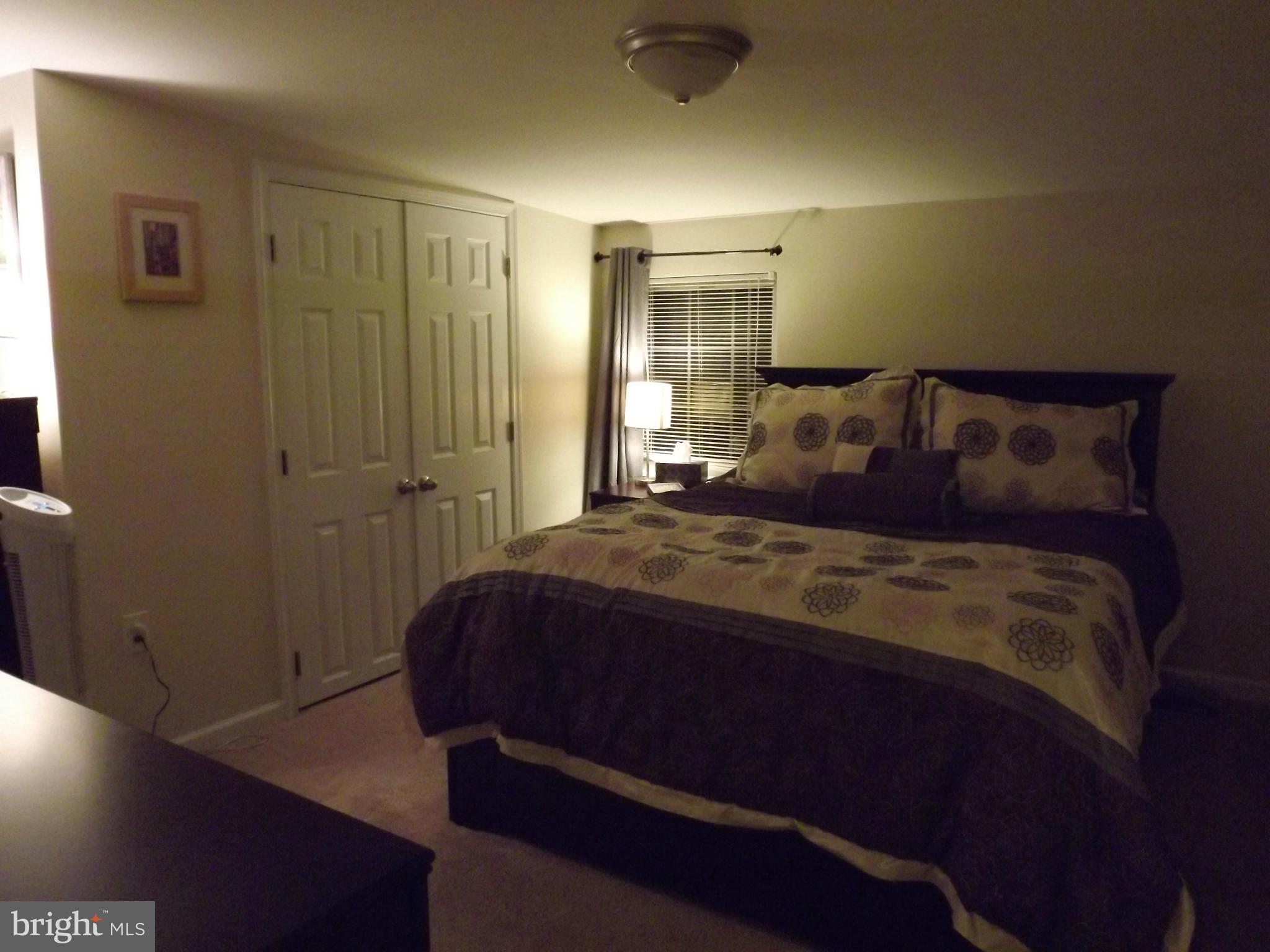 3167 Baybriar Road Baltimore, MD 21222 - Photo 23 of 30 a bedroom with a bed and a table