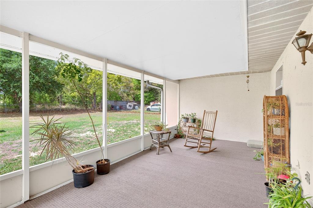 10 Almond Trace Ocala, FL 34472 - Photo 22 of 29 a view of a room with gym equipment and large windows