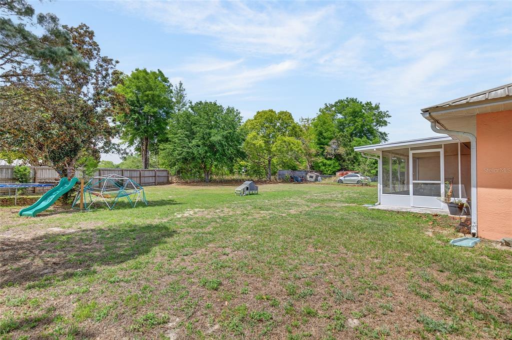 10 Almond Trace Ocala, FL 34472 - Photo 25 of 29 a garden with trees in the background