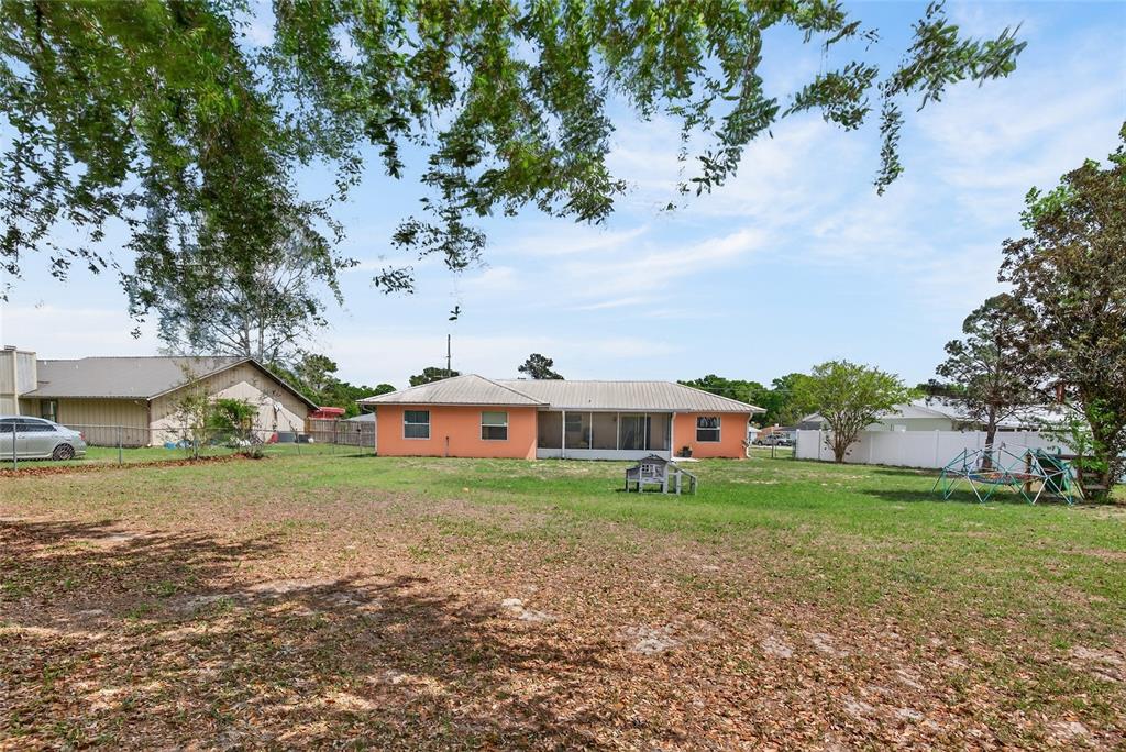 10 Almond Trace Ocala, FL 34472 - Photo 26 of 29 front view of a house with a yard