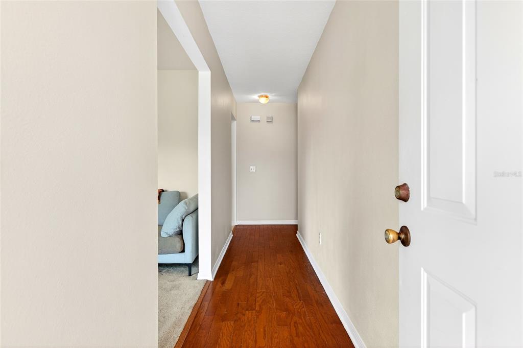10 Almond Trace Ocala, FL 34472 - Photo 4 of 29 a view of a hallway with wooden floor