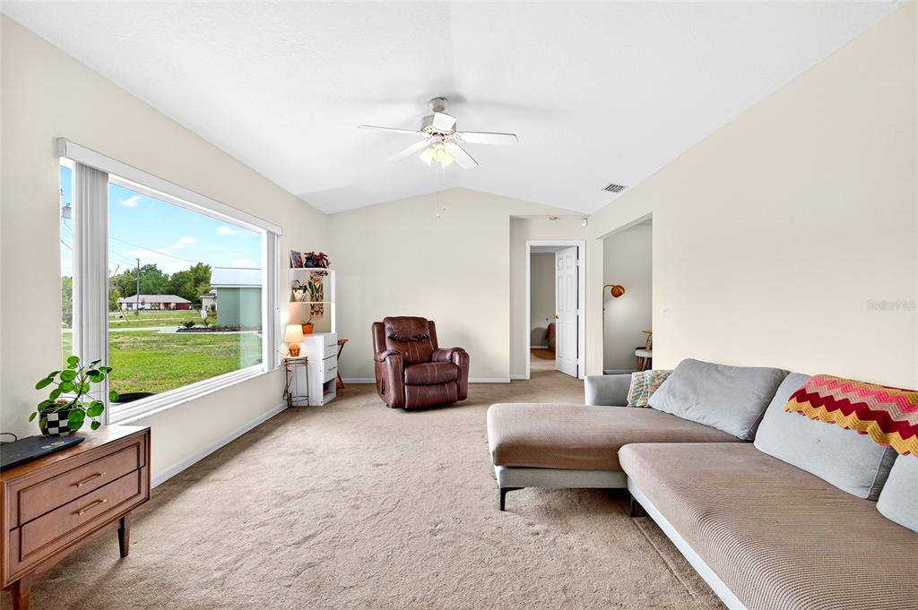 10 Almond Trace Ocala, FL 34472 - Photo 5 of 29 a living room with furniture and a large window