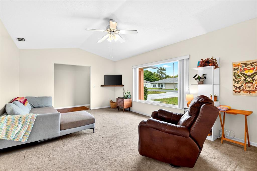 10 Almond Trace Ocala, FL 34472 - Photo 7 of 29 a living room with furniture and a flat screen tv