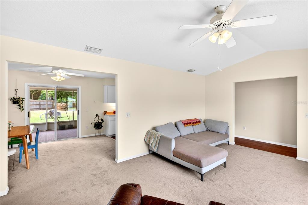 10 Almond Trace Ocala, FL 34472 - Photo 8 of 29 a living room with furniture and a chandelier