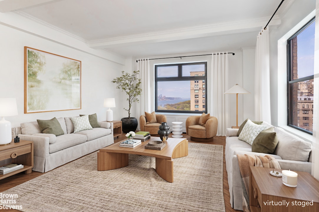 37 Riverside Drive, Unit 10B Manhattan, NY 10023 - Photo 1 of 25 a living room with furniture and a large window