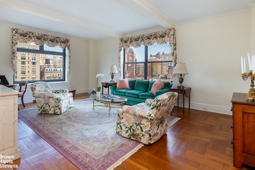 37 Riverside Drive, Unit 10B Manhattan, NY 10023 - Photo 10 of 25 a living room with furniture large window and wooden floor