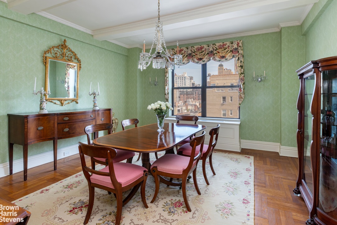37 Riverside Drive, Unit 10B Manhattan, NY 10023 - Photo 11 of 25 a view of a dining room with furniture and a chandelier