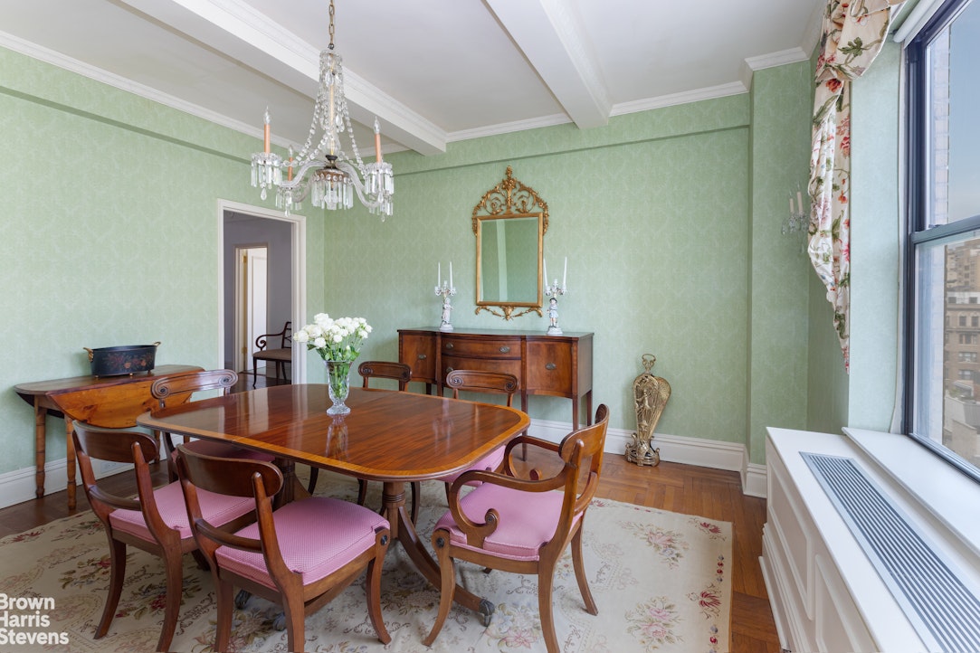 37 Riverside Drive, Unit 10B Manhattan, NY 10023 - Photo 12 of 25 a view of a dining room with furniture and a chandelier