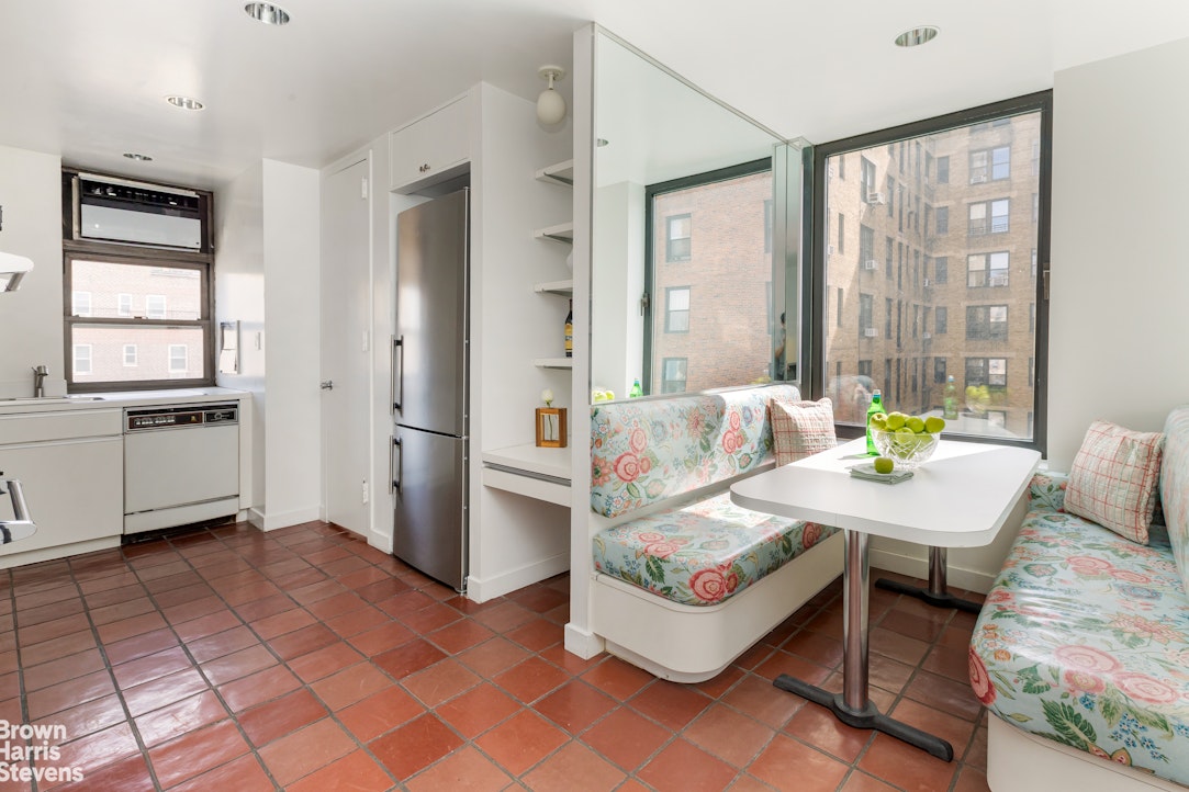 37 Riverside Drive, Unit 10B Manhattan, NY 10023 - Photo 13 of 25 a living room with furniture and a window