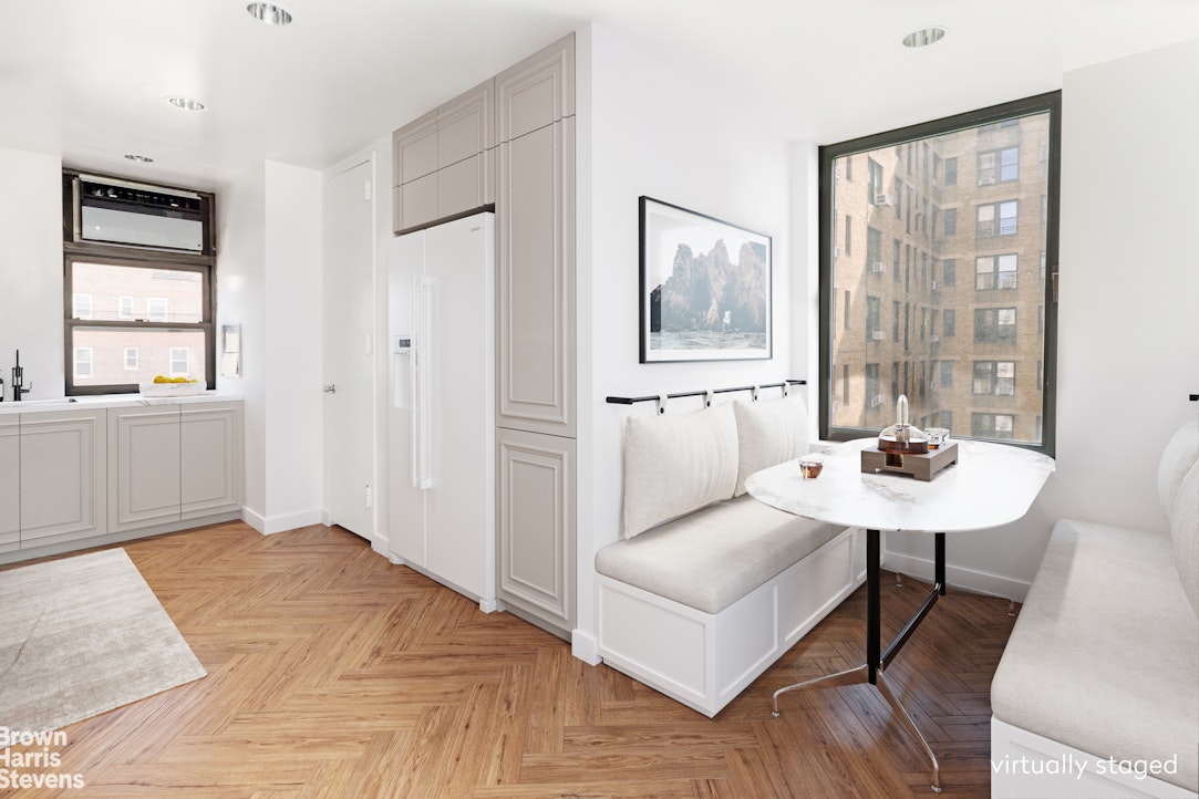 37 Riverside Drive, Unit 10B Manhattan, NY 10023 - Photo 3 of 25 a view of a bedroom with a bed and wooden floor