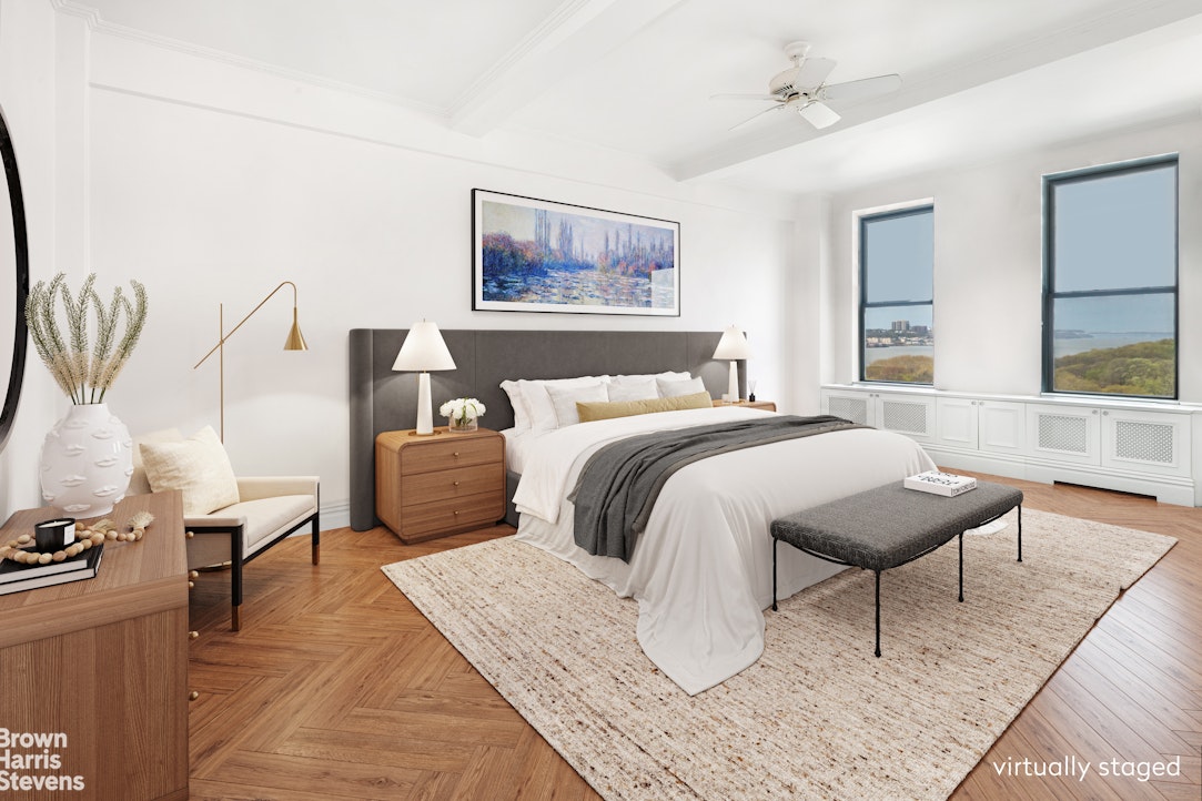 37 Riverside Drive, Unit 10B Manhattan, NY 10023 - Photo 5 of 25 a bedroom with a bed and wooden floor