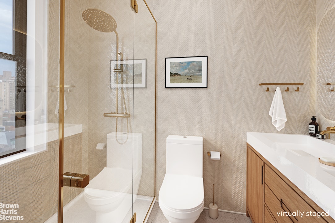 37 Riverside Drive, Unit 10B Manhattan, NY 10023 - Photo 7 of 25 a bathroom with a sink a toilet and shower