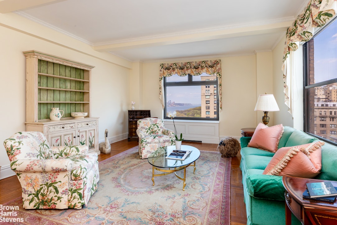 37 Riverside Drive, Unit 10B Manhattan, NY 10023 - Photo 9 of 25 a living room with furniture and a window