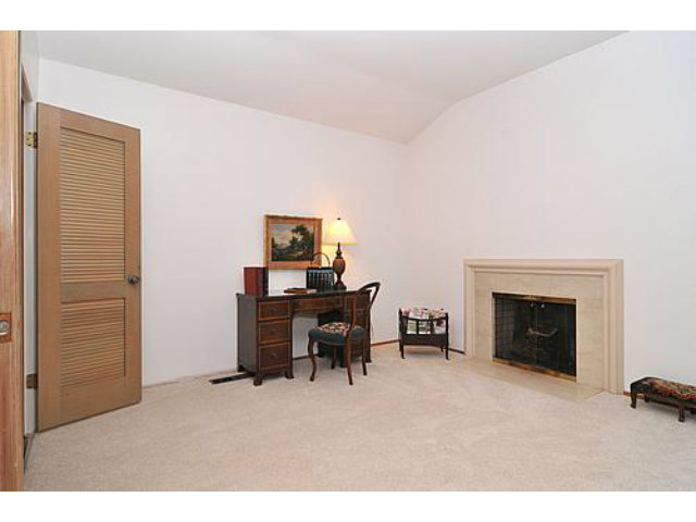 225 Robin Road Hillsborough, CA 94010 - Photo 13 of 18 a living room with furniture and a fireplace