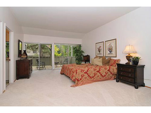 225 Robin Road Hillsborough, CA 94010 - Photo 14 of 18 a bed sitting in a spacious bedroom next to a window