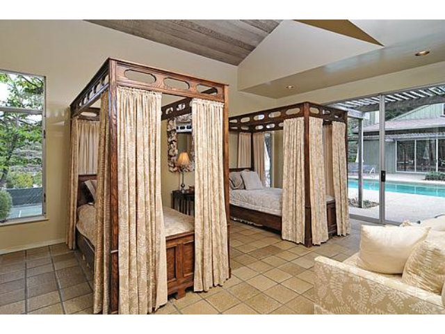 225 Robin Road Hillsborough, CA 94010 - Photo 16 of 18 a bathroom with a glass shower door and a mirror