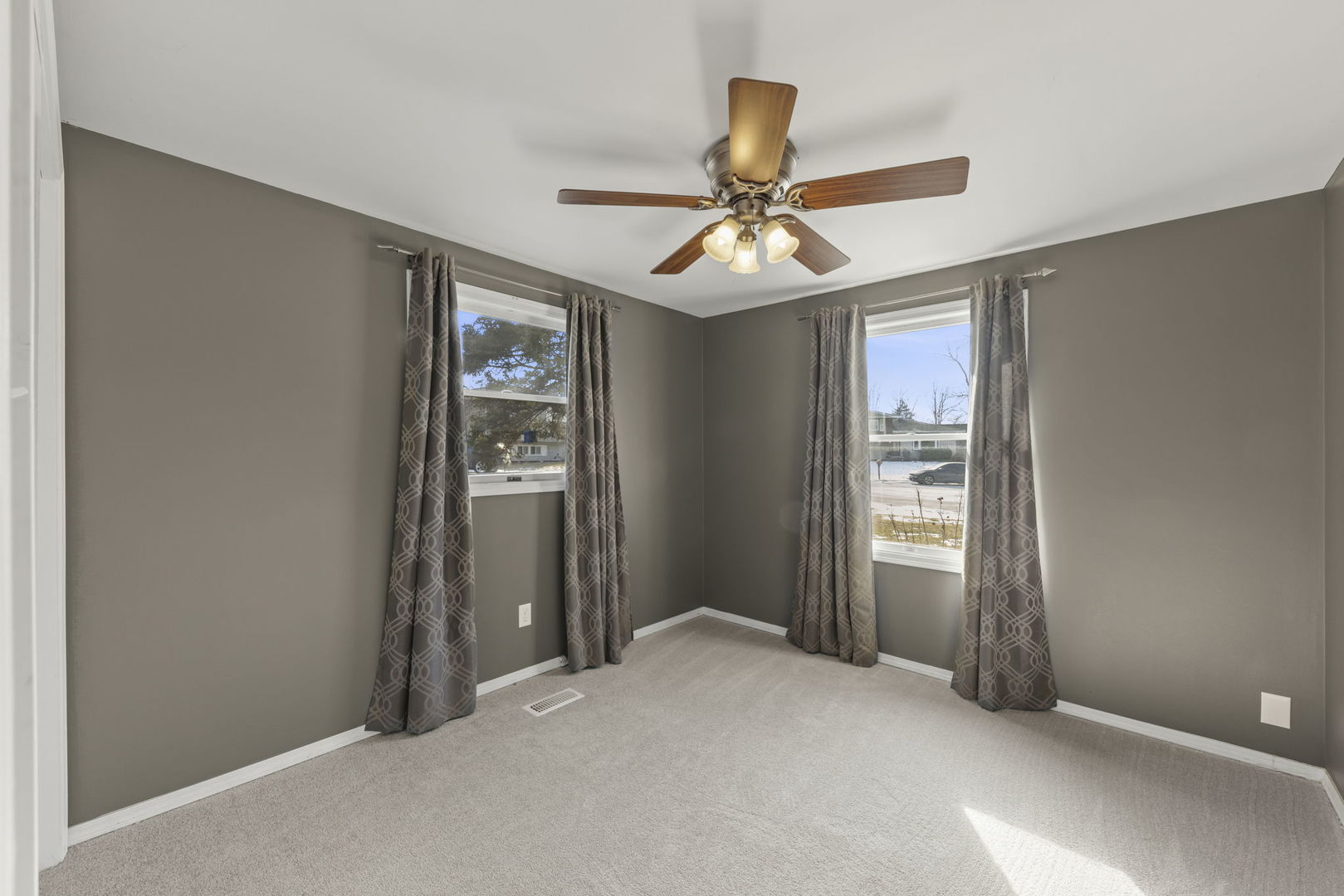 548 Jo Ann Court Lockport, IL 60441 - Photo 15 of 20 a view of a livingroom with a ceiling fan and window