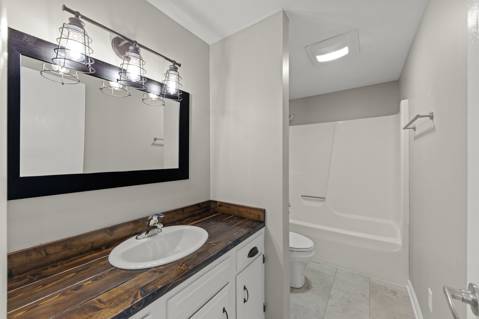 548 Jo Ann Court Lockport, IL 60441 - Photo 17 of 20 a bathroom with a granite countertop sink toilet and shower