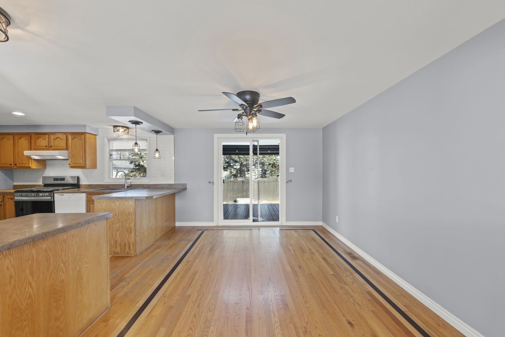 548 Jo Ann Court Lockport, IL 60441 - Photo 6 of 20 a view of a kitchen with wooden floor and stainless steel appliances