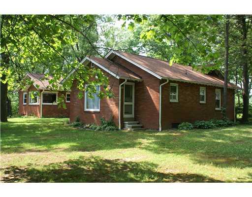 60 Ronda Lane Indiana, PA 15701 - Photo 2 of 17 Exterior Back. Large "U" shaped brick ranch on the front edge of 80 +/- acres! This view reveals exit from the master bedroom to the back yard.