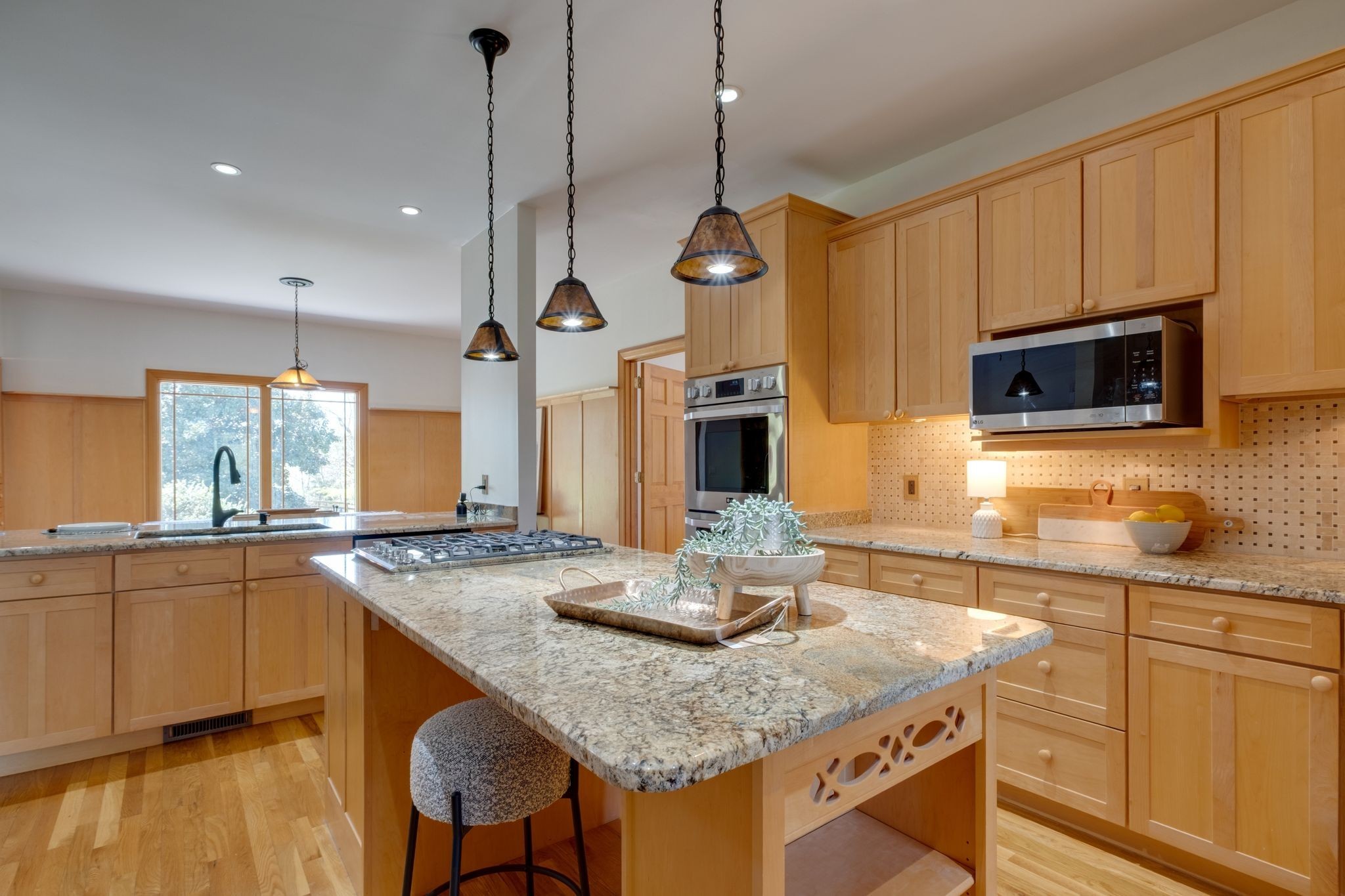 1249 White Road Bon Aqua, TN 37025 - Photo 15 of 60 a kitchen with stainless steel appliances granite countertop a sink a stove and a wooden floors