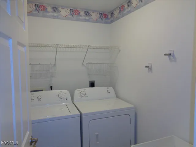 a utility room with dryer and washer