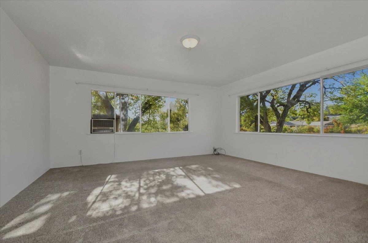 90 Gopher Flat Road Sutter Creek, CA 95685 - Photo 11 of 43 an empty room with windows