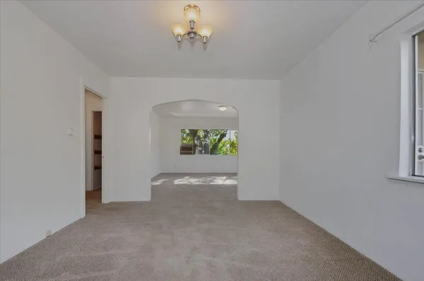 a view of a kitchen cabinets and wooden floor