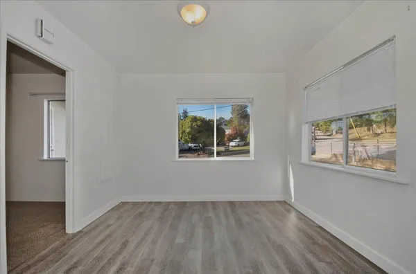 a kitchen with stainless steel appliances granite countertop a sink a stove and a refrigerator