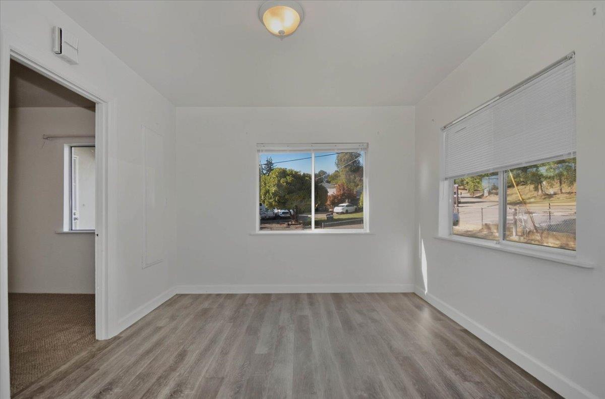 90 Gopher Flat Road Sutter Creek, CA 95685 - Photo 14 of 43 a view of an empty room with wooden floor and a window